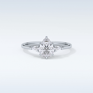 Elegant 0.86 CT Three Stones Engagement Ring Featuring Pear Moissanite