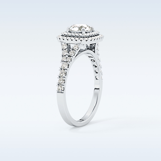 0.79 CT Double Halo & Pave Engagement Ring Featuring Round Moissanite