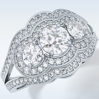 0.56 CT Cluster & Split Shank Engagement Ring Featuring Round Moissanite