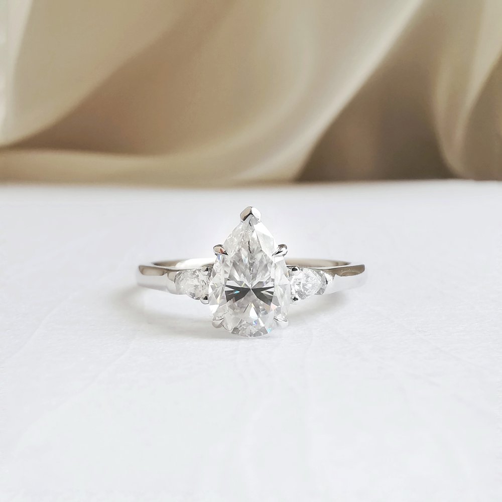 1.50 CT Pear Shaped Moissanite Three Stone Engagement Ring 1