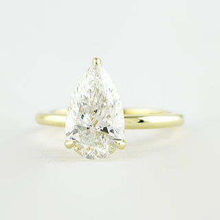 1.5 CT Pear Cut Solitaire Style Moissanite Engagement Ring 1
