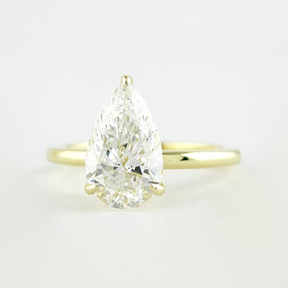 1.5 CT Pear Cut Solitaire Style Moissanite Engagement Ring 1